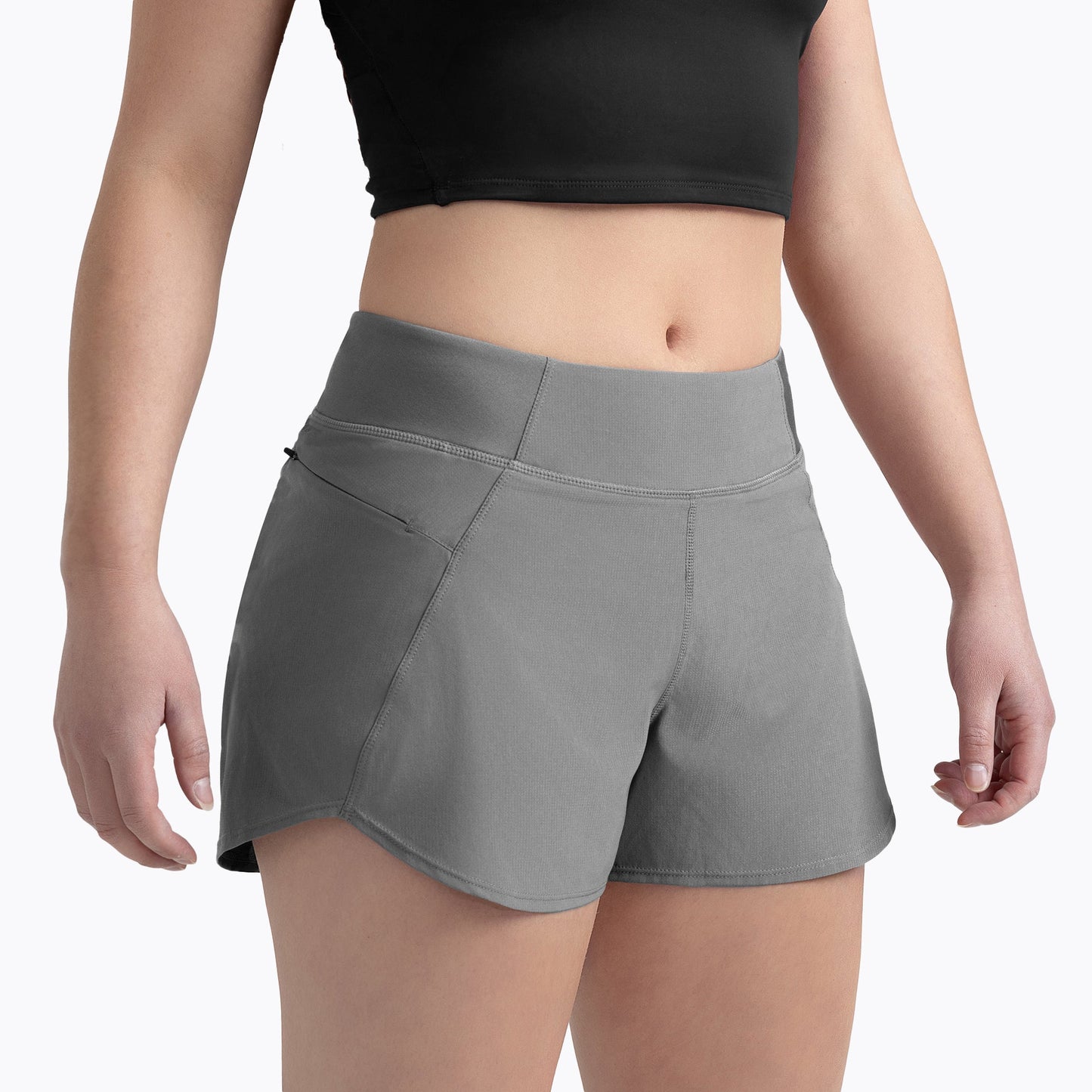 Front angled shot: Athlete wearing the Women’s Artemis Shorts in Cool Gray on a white background
