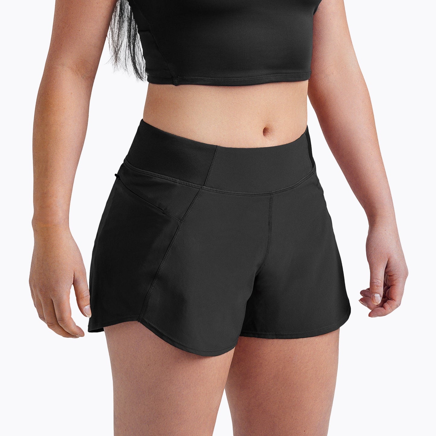 Front angled shot: Athlete wearing the Women’s Artemis Shorts in Black on a white background