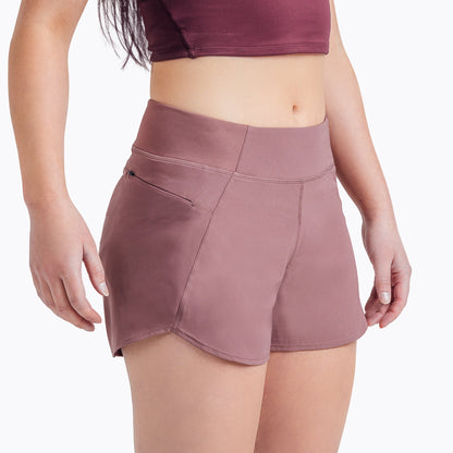 Front angled shot: Athlete wearing the Women’s Artemis Shorts in Mauve on a white background