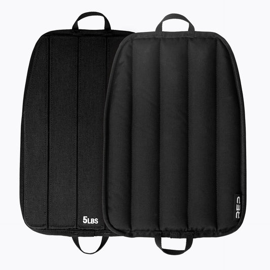 Black soft weight vest plates with '5 lbs' marking on a white background